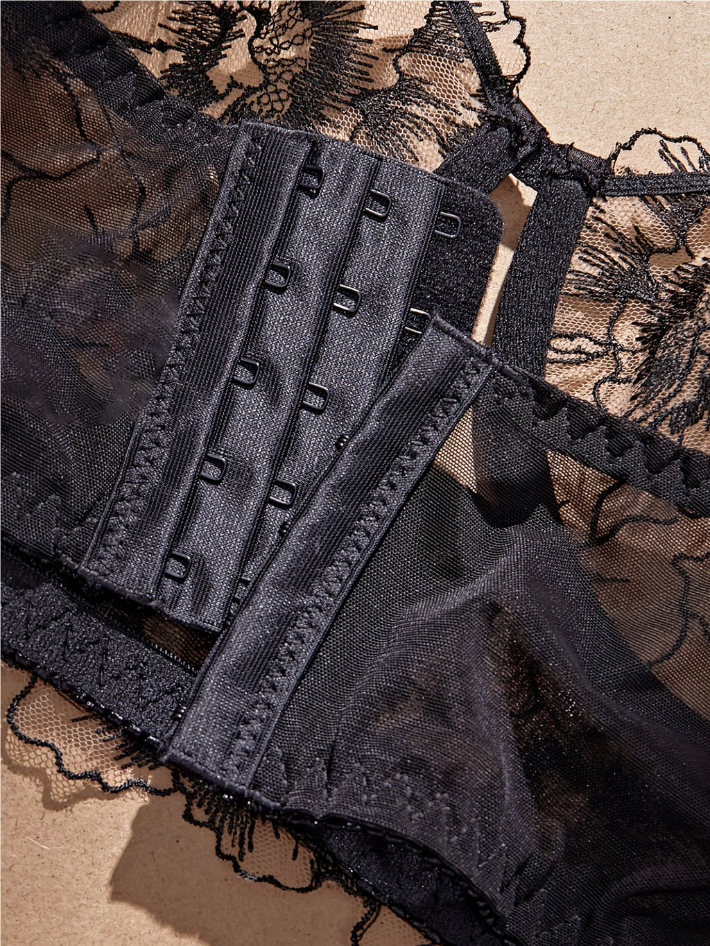 A Black Semi-Transparent Embroidered Plus-Size Bra And Panty Set, Designed for Curvy Women. This Exquisite Lingerie Set Features Delicate Embroidery, a Semi-Transparent Design, Floral Patterns, And a Lifting Effect