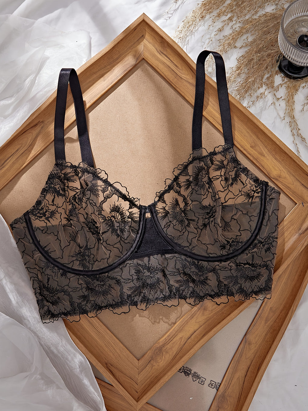 A Black Semi-Transparent Embroidered Plus-Size Bra And Panty Set, Designed for Curvy Women. This Exquisite Lingerie Set Features Delicate Embroidery, a Semi-Transparent Design, Floral Patterns, And a Lifting Effect